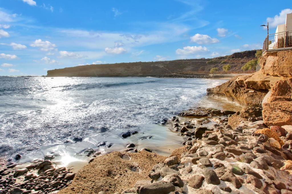 La Casa del Capitán - rocky-coastline-waves